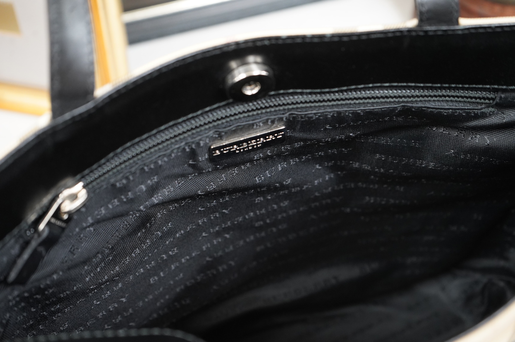 A Burberry handbag with PCV check exterior, 28cm wide